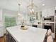 Bright, open kitchen with large island, pendant lighting, and stainless appliances at 643 Baron Rd # 8, Waxhaw, NC 28173