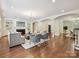 Spacious living room with fireplace, built-in shelving, hardwood floors, and elegant archways at 643 Baron Rd # 8, Waxhaw, NC 28173