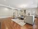 This living room boasts hardwood floors, elegant archways, and a comfortable seating arrangement at 643 Baron Rd # 8, Waxhaw, NC 28173