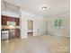 Open concept living area with a kitchenette and a doorway leading into the bedroom at 643 Baron Rd # 8, Waxhaw, NC 28173