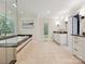 Bright bathroom featuring a glass enclosed shower, soaker tub, and lots of counter space at 643 Baron Rd # 8, Waxhaw, NC 28173