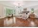 Spacious main bedroom featuring hardwood floors, a bay window, and ample natural light at 643 Baron Rd # 8, Waxhaw, NC 28173