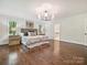 Spacious main bedroom featuring hardwood floors and ample natural light at 643 Baron Rd # 8, Waxhaw, NC 28173