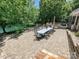 Spacious patio with lake view, built-in grill, and a long table for outdoor dining at 643 Baron Rd # 8, Waxhaw, NC 28173