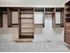 Spacious walk-in closet featuring custom wood shelving and ample storage space at 643 Baron Rd # 8, Waxhaw, NC 28173