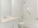 Neat and bright bathroom featuring a shower-tub combo, toilet, and a vanity with cabinet storage at 6817 Dumbarton Dr, Charlotte, NC 28210