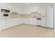 Functional kitchen offers white cabinets and appliances, and ample counter space at 6817 Dumbarton Dr, Charlotte, NC 28210
