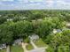 Aerial view of a home nestled among lush greenery in a quiet neighborhood at 716 Mooresville Rd, Salisbury, NC 28144