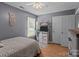 Bedroom with hardwood floors, ceiling fan, and a double-door closet at 716 Mooresville Rd, Salisbury, NC 28144