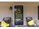 Inviting porch with seating and a wreath at 716 Mooresville Rd, Salisbury, NC 28144