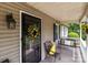 Charming front porch featuring a porch swing and decorative hanging plants at 716 Mooresville Rd, Salisbury, NC 28144