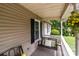 This porch features a swing, seating, and hanging flowers at 716 Mooresville Rd, Salisbury, NC 28144
