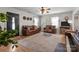 Bright living room with hardwood floors, comfortable leather sofas, and ample natural light at 716 Mooresville Rd, Salisbury, NC 28144