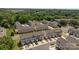 An aerial view of townhomes with a lush green backdrop and a view of the neighborhood at 718 Dillon Way # 38, Fort Mill, SC 29715