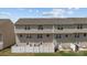 Exterior rear view of townhome featuring an outdoor patio and fenced yard at 718 Dillon Way # 38, Fort Mill, SC 29715