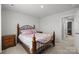 Bedroom featuring an ornate bed frame, neutral carpet, and direct access to an attached bathroom at 718 Dillon Way # 38, Fort Mill, SC 29715