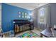 Bright Bedroom with colorful décor, a crib, and a large window at 718 Dillon Way # 38, Fort Mill, SC 29715