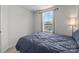 Bedroom featuring neutral walls, carpet floors, and a bed with a large window at 718 Dillon Way # 38, Fort Mill, SC 29715
