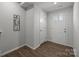 Inviting hallway entrance with white walls, wood-look floors, and a door, creating a welcoming atmosphere at 718 Dillon Way # 38, Fort Mill, SC 29715