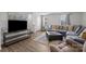 Bright living room featuring a couch, entertainment center, windows, and an open floor plan at 718 Dillon Way # 38, Fort Mill, SC 29715