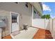 Private back patio with a grill, concrete slab, mulch and a door into the home at 718 Dillon Way # 38, Fort Mill, SC 29715