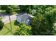 Aerial view of a well-maintained home, showcasing its charming architecture and lush surrounding trees at 73 20Th Sw Ave, Hickory, NC 28602