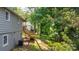Exterior view with wooden deck stairs leading to a two-story home in a green yard at 73 20Th Sw Ave, Hickory, NC 28602