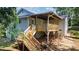 Exterior back view showcasing a two-story home with a charming wooden deck and stairs at 73 20Th Sw Ave, Hickory, NC 28602