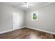 Bright bedroom featuring clean white trim, wood flooring, and an abundance of natural light at 73 20Th Sw Ave, Hickory, NC 28602