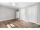 Bedroom showcasing wood flooring, ceiling fan, and multiple closet/storage options at 73 20Th Sw Ave, Hickory, NC 28602