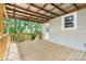 Covered deck with wood railing, providing an inviting outdoor space for relaxation and entertainment at 73 20Th Sw Ave, Hickory, NC 28602