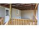 Spacious, covered wooden deck featuring gray siding and a side door for convenient access at 73 20Th Sw Ave, Hickory, NC 28602