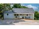 Charming exterior view of home with welcoming porch, and lush greenery at 73 20Th Sw Ave, Hickory, NC 28602