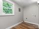 Laundry room featuring wood flooring, natural light, and utility connections at 73 20Th Sw Ave, Hickory, NC 28602