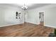 Inviting living room with hardwood floors, a stylish chandelier and a view to the kitchen at 73 20Th Sw Ave, Hickory, NC 28602