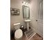 A half bathroom featuring a modern sink and toilet, complemented by an eye-catching accent rug at 734 Herlong Ave, Rock Hill, SC 29732