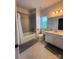 Bright bathroom featuring tile flooring, shower-tub combo, and vanity at 734 Herlong Ave, Rock Hill, SC 29732