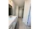 Bathroom featuring double vanity sinks and an open glass walk-in shower at 734 Herlong Ave, Rock Hill, SC 29732