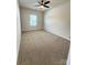 Spacious bedroom with plush carpeting and a modern ceiling fan at 734 Herlong Ave, Rock Hill, SC 29732