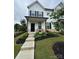 Charming two-story home with a welcoming front porch, well-manicured landscaping, and a freshly painted white exterior at 734 Herlong Ave, Rock Hill, SC 29732