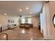 Spacious living room with natural light, hardwood floors, a modern ceiling fan, and two couches at 734 Herlong Ave, Rock Hill, SC 29732