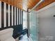 Updated bathroom featuring glass enclosed shower and checkered floors at 828 N Main St, Mount Pleasant, NC 28124