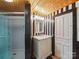 Stylish bathroom with glass enclosed shower and black and white accents at 828 N Main St, Mount Pleasant, NC 28124