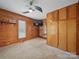 Cozy bedroom with wood paneling and built-in storage cabinets at 828 N Main St, Mount Pleasant, NC 28124