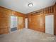 Unique bedroom showcasing wood paneled walls and built-in loft area at 828 N Main St, Mount Pleasant, NC 28124