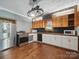 Well-lit kitchen with hardwood floors, stainless steel appliances, and ample counter space at 828 N Main St, Mount Pleasant, NC 28124