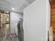 Spacious laundry room featuring a washer, dryer, and refrigerator at 828 N Main St, Mount Pleasant, NC 28124