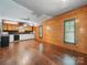 Spacious living area with wood floors, paneled walls, and cottage charm at 828 N Main St, Mount Pleasant, NC 28124