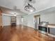 Open living room with hardwood floors, fireplace, and stainless steel appliances at 828 N Main St, Mount Pleasant, NC 28124