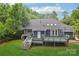 A cozy backyard with a spacious deck and lush green lawn offers a serene retreat at 8338 Rittenhouse Cir, Charlotte, NC 28270